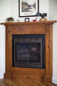 Custom cherry wood fireplace mantle. Built with wood from owner
